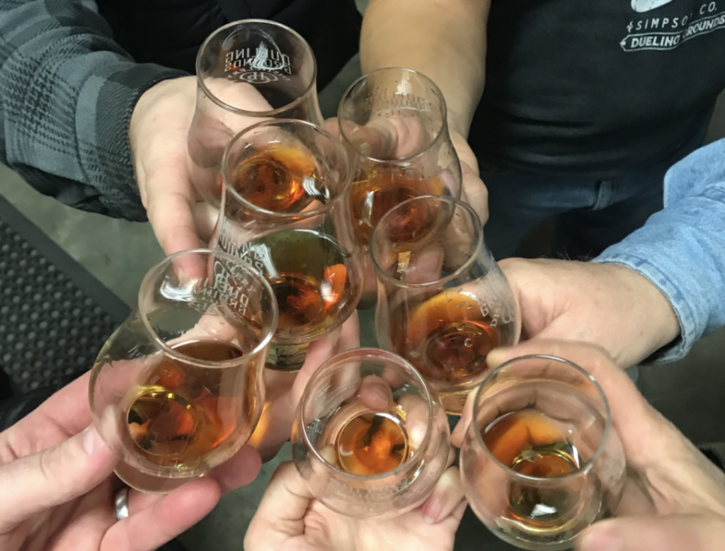 Pic shows whiskies being "cheers-ed"